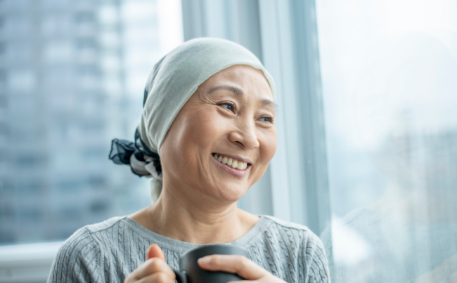 asian woman cancer patient holding cup
